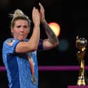 What might have been: Millie Bright of England looks dejected as she walks alongside the FIFA Women's World Cup trophy after the FIFA Women's World Cup Australia & New Zealand 2023 Final match between Spain and England (Picture: Justin Setterfield/Getty Images)
