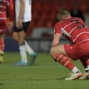 Ollie Younger sinks to his knees following Rovers' defeat to Ipswich Town. Picture: Howard Roe/AHPIX