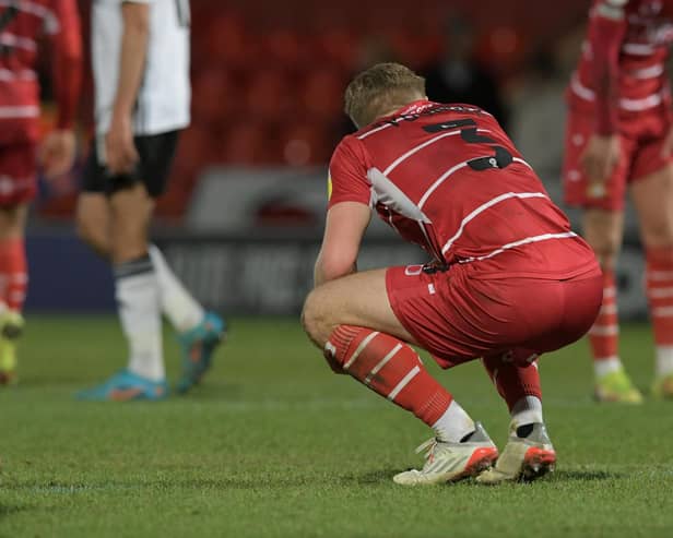 Ollie Younger sinks to his knees following Rovers' defeat to Ipswich Town. Picture: Howard Roe/AHPIX