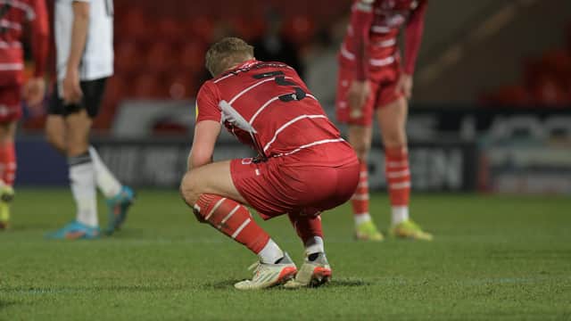Ollie Younger sinks to his knees following Rovers' defeat to Ipswich Town. Picture: Howard Roe/AHPIX