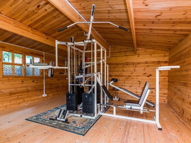 This versatile log cabin in the grounds currently holds gym equipment.