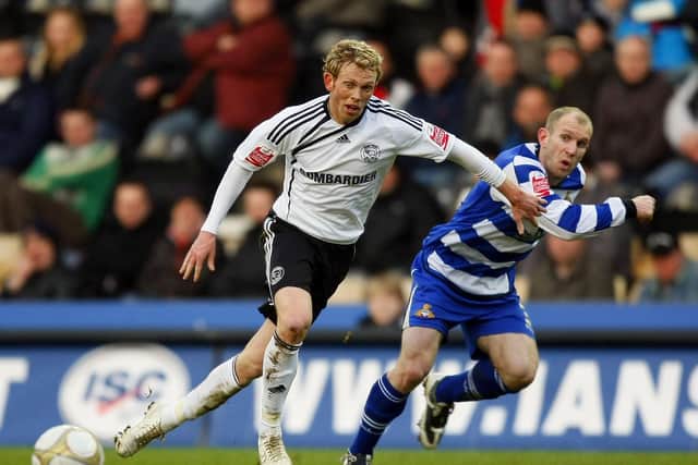 Roberts goes head-to-head against his former Doncaster Rovers teammate Paul Green, then of Derby County (photo by Tom Dulat/Getty Images).