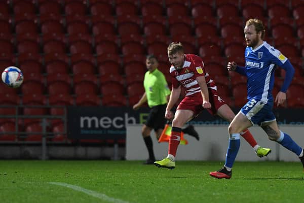 Brad Halliday smashes a shot on goal against Gillingham. Picture: Andrew Roe/AHPIX