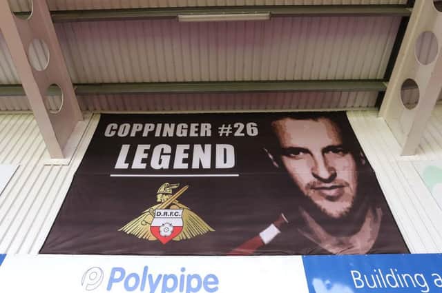The 'Coppinger Legend' banner at the Keepmoat Stadium. Photo: George Wood/Getty Images