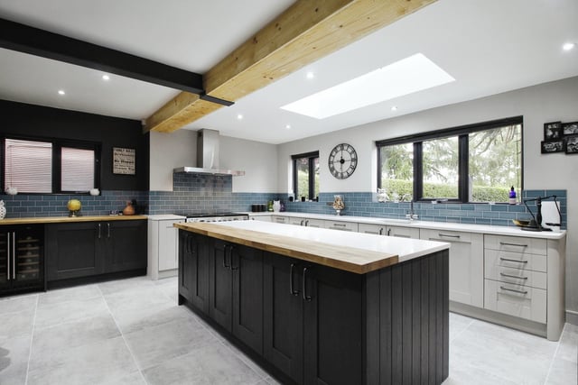 The bright, open plan and high spec kitchen with central island.