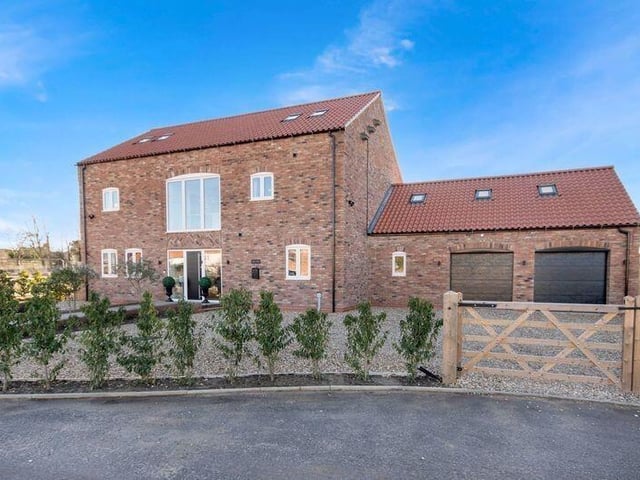 The exceptional property stands on a private road, within a gated community of eight luxury homes.