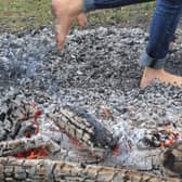 People can learn to walk on hot coals for charity.