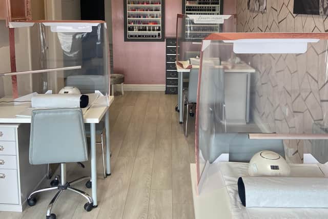 Salons have put screens in place and reduced the number of nail desks. PIcture: Michelle Brookes