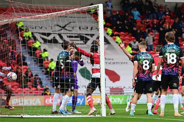 The Doncaster Rovers players celebrate the first goal.