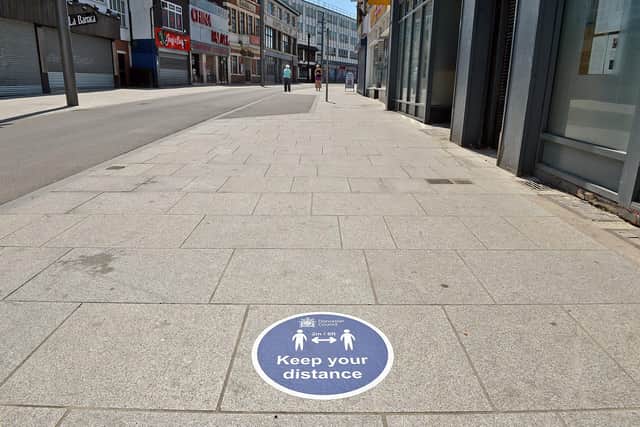Doncaster town centre is  marked out with for social distancing signs. Silver street.