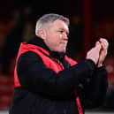 Grant McCann applauds the away fans after Rovers' thumping win at Grimsby.
