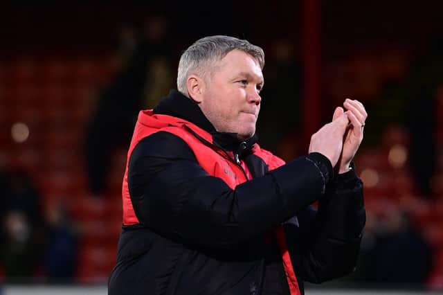 Grant McCann applauds the away fans after Rovers' thumping win at Grimsby.