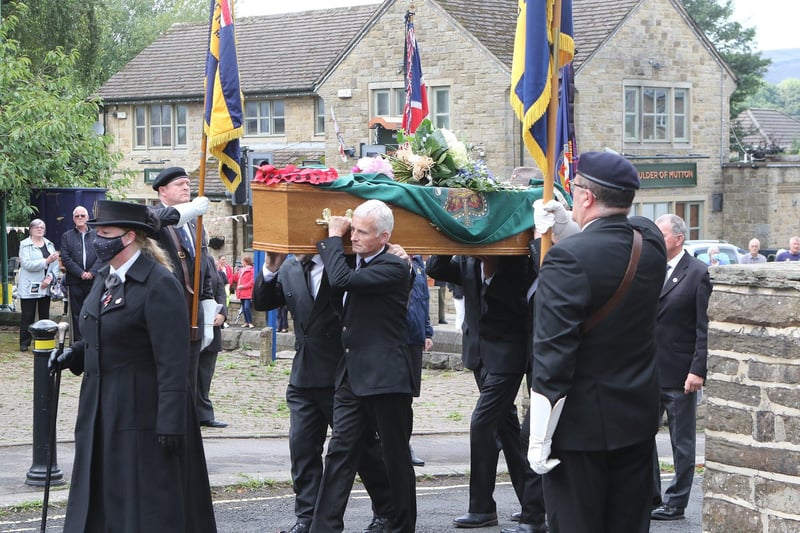 Mr Eley's coffin is carried past the standard bearers