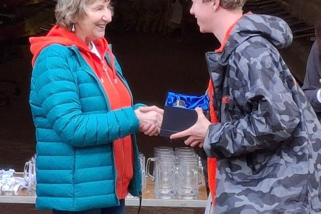 Mike's mother presenting his award to Liam Carroll (Burton Leander)
