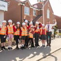 (L-R) Joshua Johnson (Harworth), with the pupils from Harworth C of E Academy, Paul Walters (Harron Homes) and Joel Edwards (Head of Year 6, Harworth C of E)