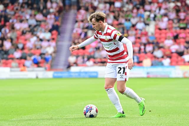 Doncaster's Kyle Hurst prepares to take on a defender.
