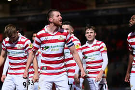 Doncaster Rovers captain Tom Anderson celebrates his match-winning goal.