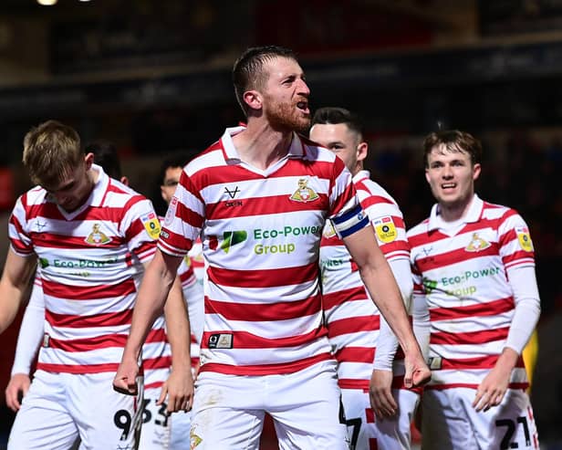 Doncaster Rovers captain Tom Anderson celebrates his match-winning goal.