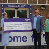 Handing over the fundraising cheque to Bluebell Wood Childrem's Hospice