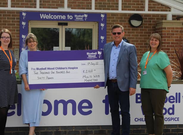 Handing over the fundraising cheque to Bluebell Wood Childrem's Hospice