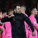 Danny Schofield celebrates Saturday's win over Grimsby with 1,200 travelling fans.