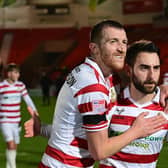 Doncaster's Tom Anderson and Ben Close celebrate the win over Carlisle United.