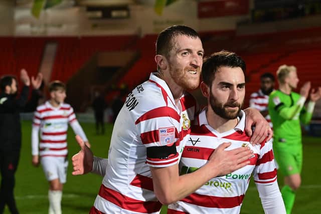 Doncaster's Tom Anderson and Ben Close celebrate the win over Carlisle United.
