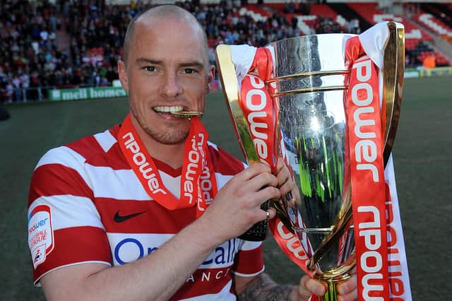 Iain Hume with the League One trophy. Picture: Andrew Roe