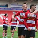 Doncaster's Luke Molyneux celebrates his goal with Owen Bailey. Jamie Sterry, another North-east native, is in the background.