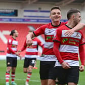 Doncaster's Luke Molyneux celebrates his goal with Owen Bailey. Jamie Sterry, another North-east native, is in the background.