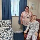 Jo Booker from City of Doncaster Council with ‘Sam’ the new medical manikin in Aspire to Be’s mock social care room.