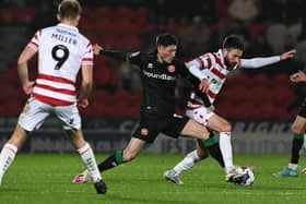 Ben Close tussles with Jack Earing in Doncaster Rovers' defeat to Walsall.