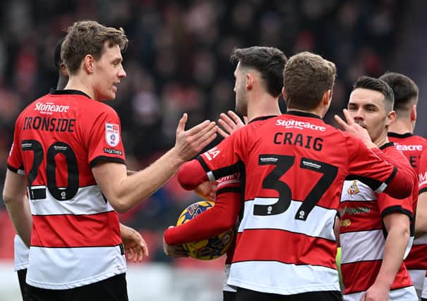 Rovers celebrate the opening goal against Tranmere. (Picture Howard Roe/AHPIX LTD)