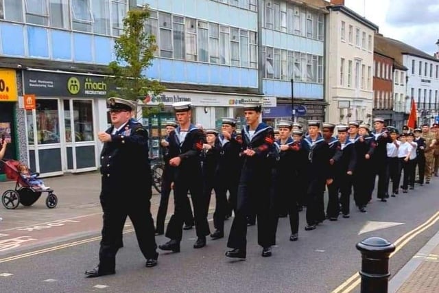 Military personnel march along Hall Gate.