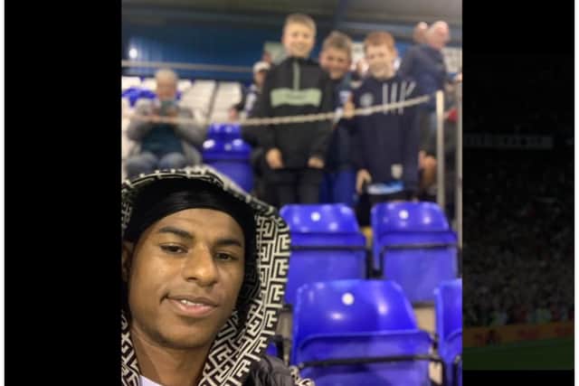 Marcus Rashford poses for a selfie with fans at Barrow. Credit: https://twitter.com/OurBluebirdsFly/status/1569777177784115200