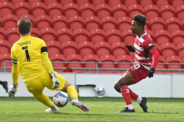 Jason Lokilo sees Doncaster Rovers' best chance of the afternoon blocked out by Wigan keeper Jamie Jones. Picture: Andrew Roe/AHPIX