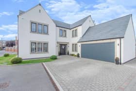 This private gated development is approached by double wrought iron secure entry tall gates. The property has a lawned garden to the front and a wide block paved driveway providing ample off road parking and giving access to the double garage which has electric door, light and power and a staircase rising to the eaves which has been boarded for storage.