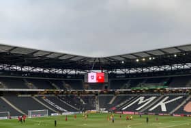 Rovers warm up in front of their supporters prior to kick off against MK Dons