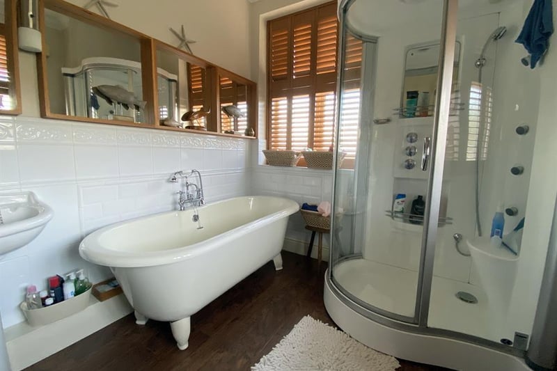 A five-piece, modern, fitted bathroom serves the master bedroom on the top floor.
