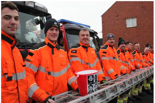 Fire crews raised nearly £4,000 on their charity hike.