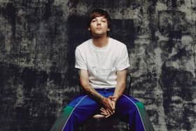 Doncaster's Louis Tomlinson says the first One Direction album was "s***"