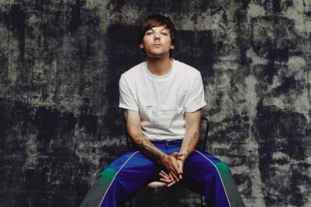 Doncaster's Louis Tomlinson says the first One Direction album was "s***"