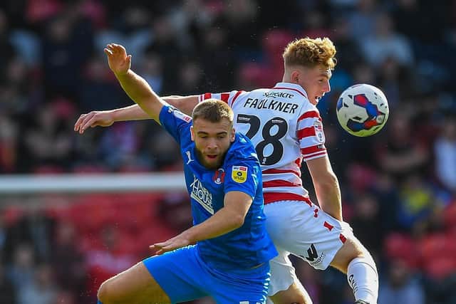 No messing: Doncaster Rovers starlet Bobby Faulkner wins a header against Leyton Orient.