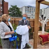 Diane Smith and Richard Parker unveil the new Rainbow Garden at DRI.