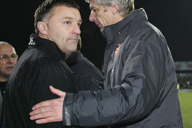 Dave Penney, manager of Doncaster, shakes hands with Arsene Wenger after Arsenal's Carling Cup Quarter Final win at Doncaster Rovers on December 21, 2005.