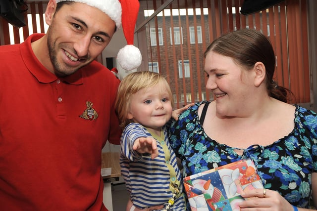 Billy Paynter with Natasha Quinn of Lindholme and one-year-old Reuben at DRI during Christmas 2013