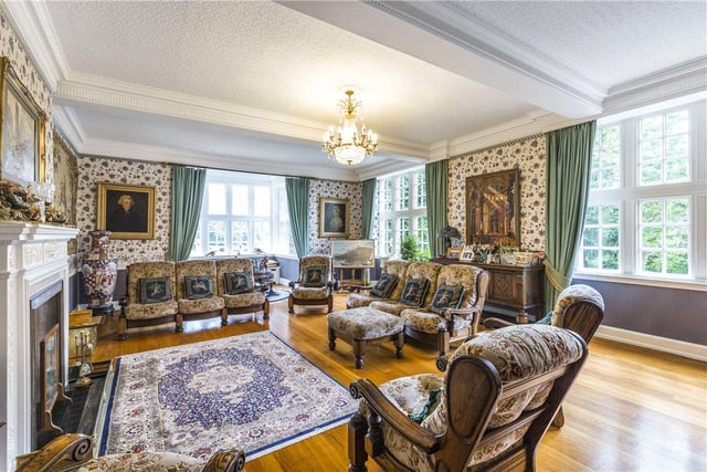 Generous in size, the grand living room is bright and airy, with large windows allowing plenty of light to fill the room, and enough seating for family gatherings.