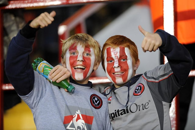 Two young Blades pose for the camera after getting their faces painted