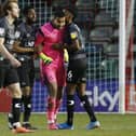 Ellery Balcombe is congratulated after his double penalty save against Lincoln