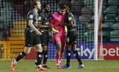 Ellery Balcombe is congratulated after his double penalty save against Lincoln